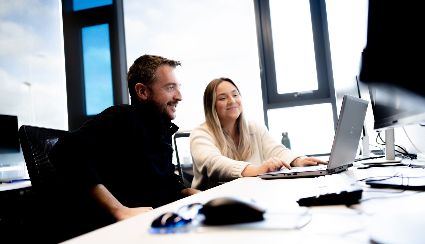 employee getting trained on a laptop